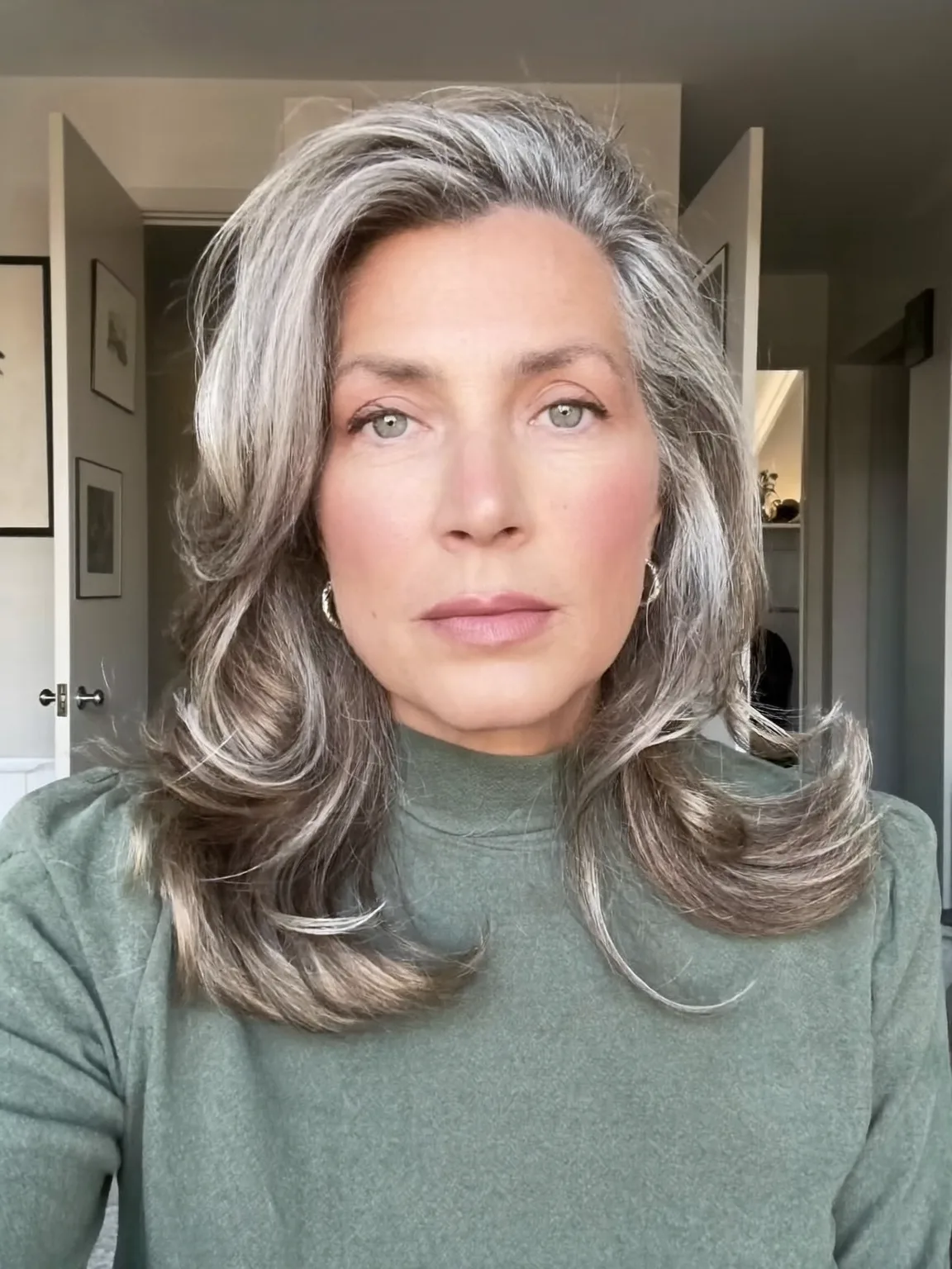Shoulder-Length Wavy Silver with Dark Undertones and Side Bangs